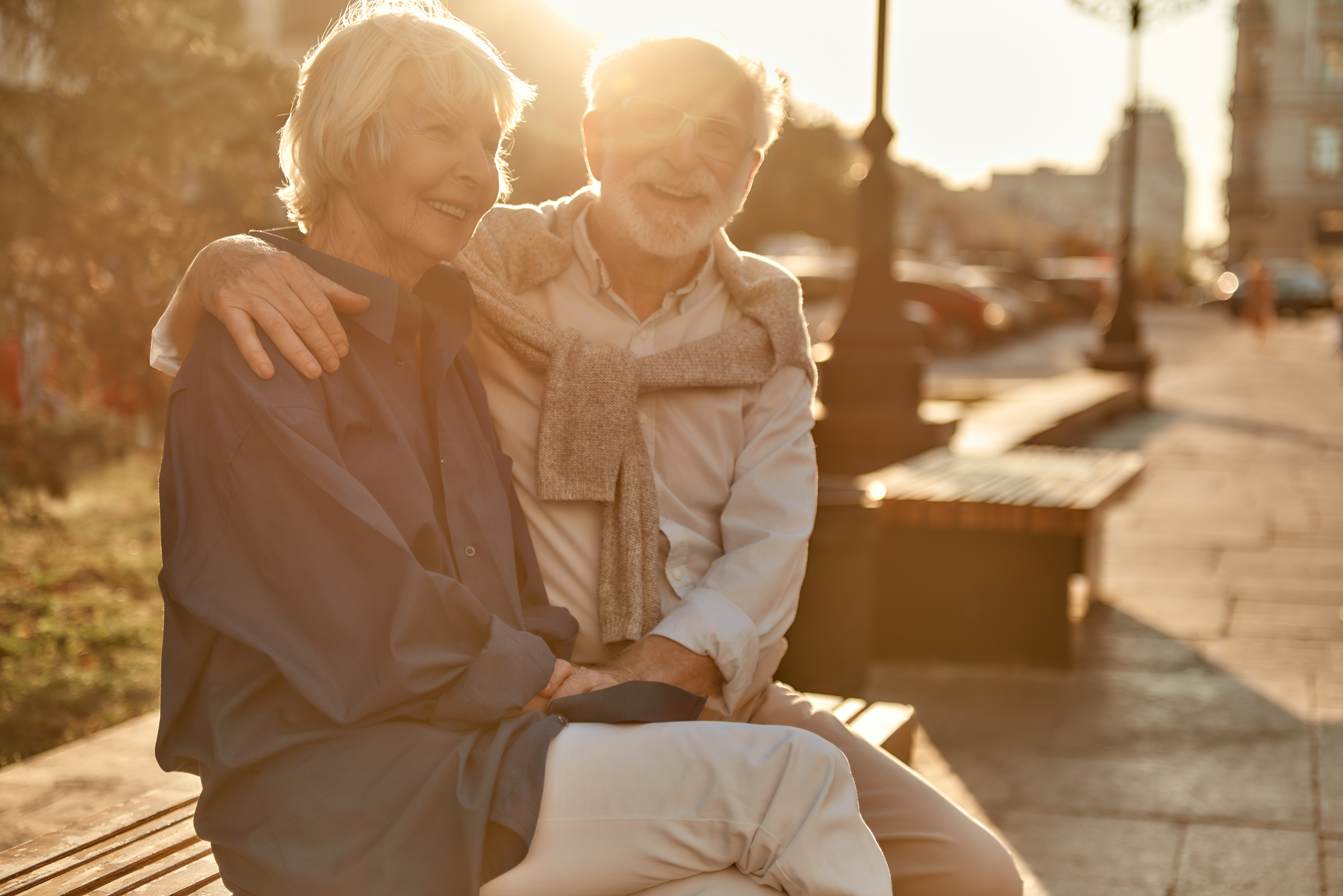 Everyday is better with you. Happy and beautiful senior couple in casual clothes smiling while sitting on the bench together. Senior man and woman. Love concept. Old age